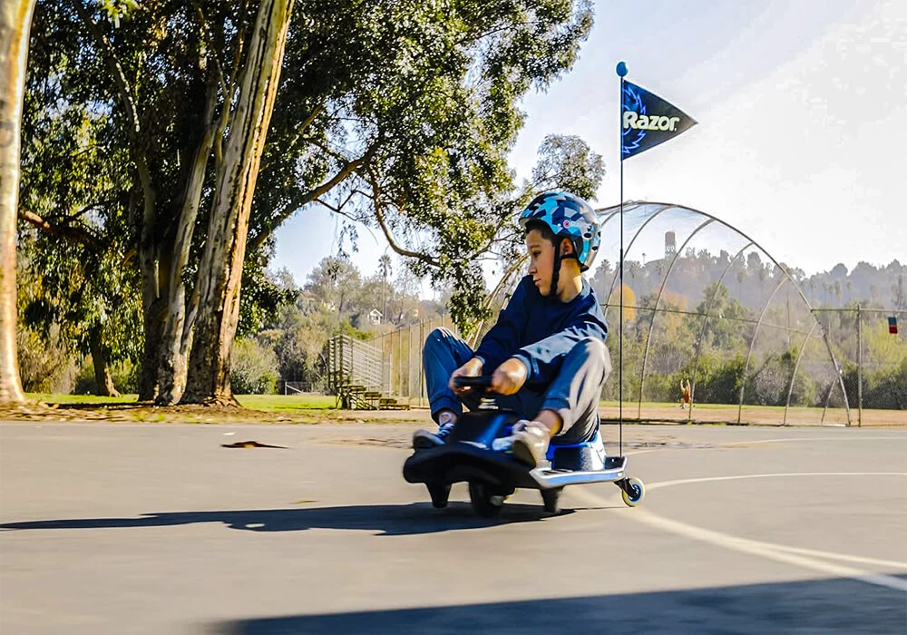An electric-powered Razor Crazy Cart, a compact and dynamic go-kart with a sleek design, suitable for thrilling spins and maneuvers.